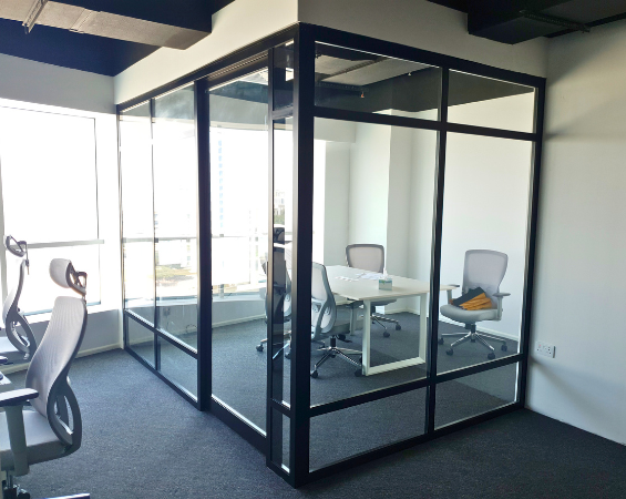 Glass cabin meeting room in a Dubai commercial office