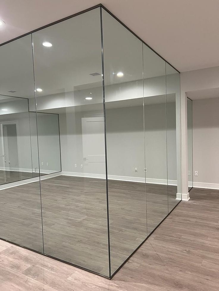 Frameless glass room in a UAE office interior