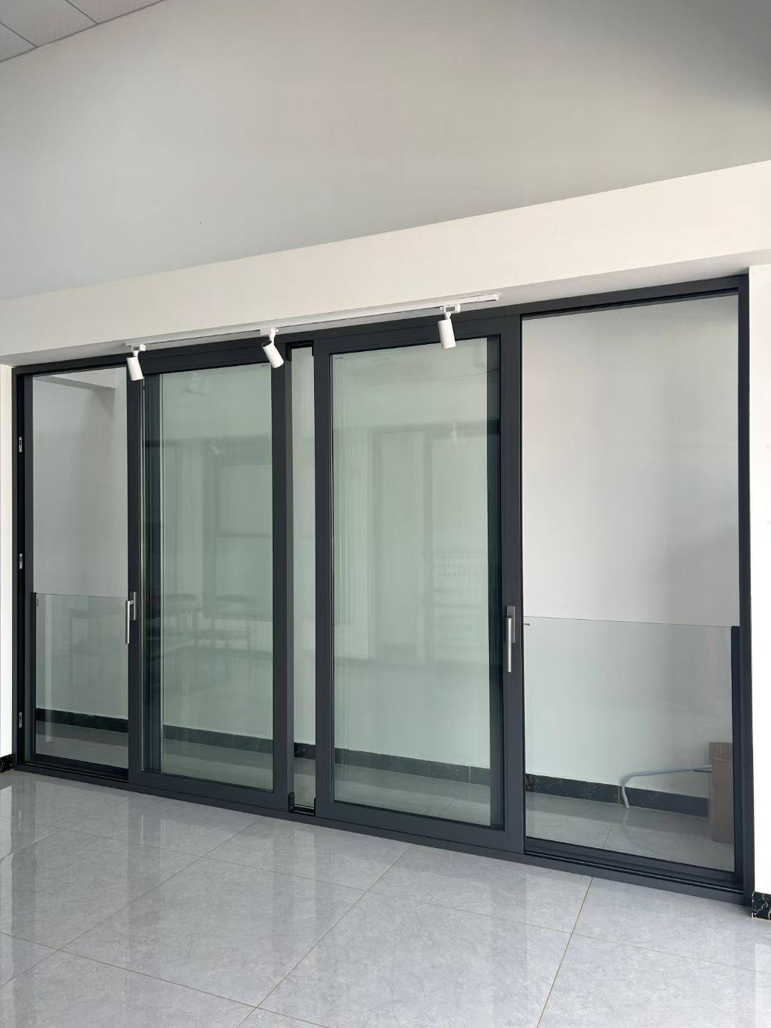 Slim profile aluminium sliding doors installation in the UAE